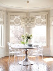 beautiful neutral and floral print Roman shades accent the space and make the nook cozy, cool and more refined
