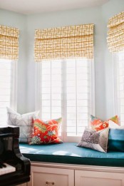 a yellow printed Roman shade is a bright and cool touch to the room, and it may add an elegant feel to any room