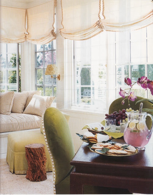 neutral Roman shades with edges add a chic and refined touch to the space and make it more private when needed