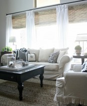 woven Roman shades paired with white curtains – only curtains feature not so much light blocking, and shades help with that