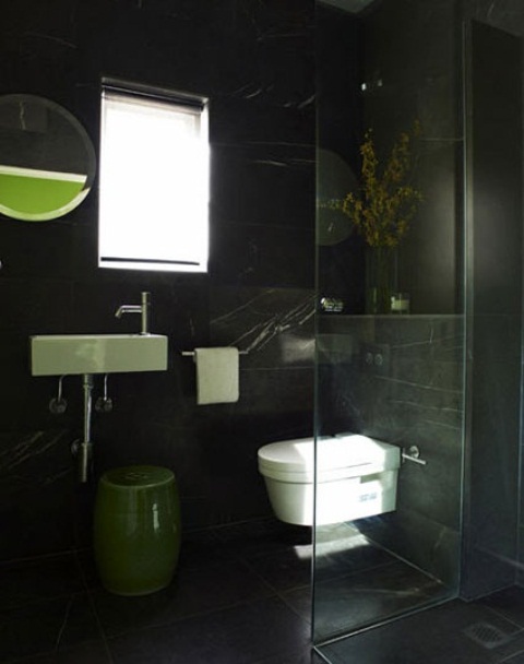 White bathroom appliances looks great on pure black walls.