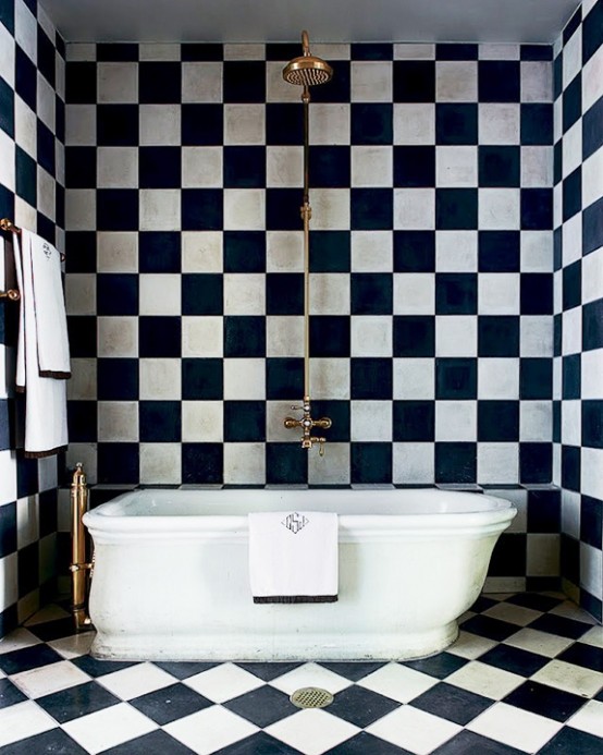 The black and white checkered tiles are responsible for giving this bathroom its personality.