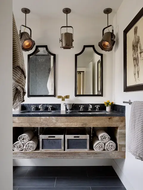 Anything industrial is a good way to make the bathroom more masculine. Floating vanity made of rustic wood boards and light fixtures do that here.