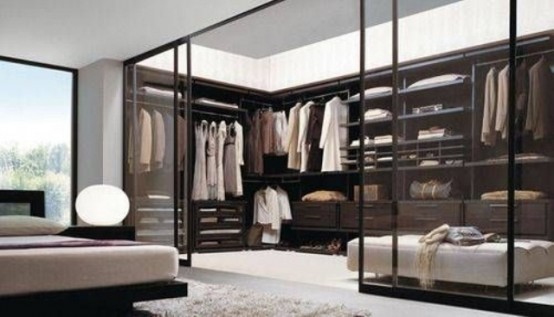 If your clothes are gorgeous, why not to organize their showcase right in your bedroom? Transparent glass doors would do the trick.