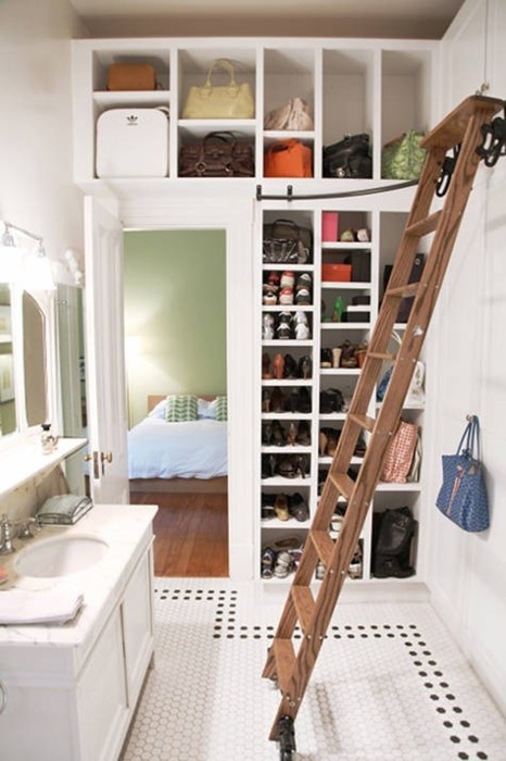Here is an awesome idea to combine a walk-in closet with a bathroom and use every ounce of space. A ladder will help to access upper cabinets and become a nice piece of decor.
