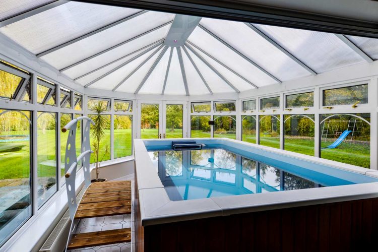 sunroom is a perfect place for an indoor pool