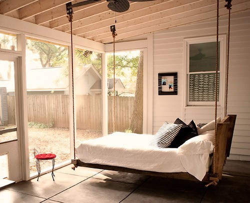 Sunroom-style bedroom. Who said you need some other furniture besides a hanging bed?