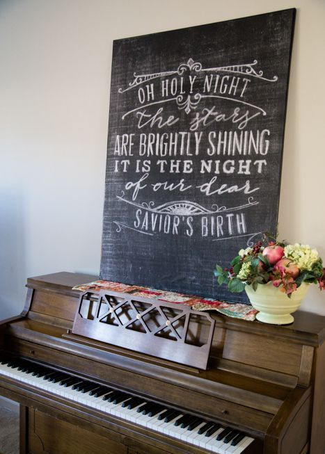 A chalkboard sign with white calligraphy is a lovely decor idea for the holidays and not only   you can change the text when you need it