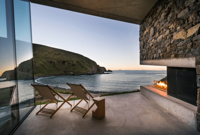 Sustainable oceanfront cabin on volcanic mountainside  10