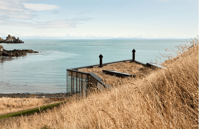 Sustainable oceanfront cabin on volcanic mountainside  2