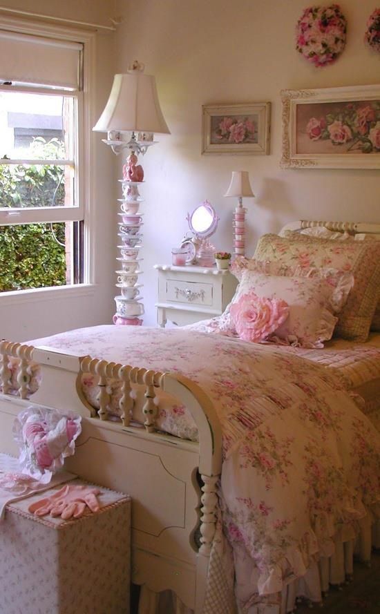 a neutral and pastel shabby chic bedroom with refined neutral furniture, a whimsy teapot lamp, floral artworks and bedding