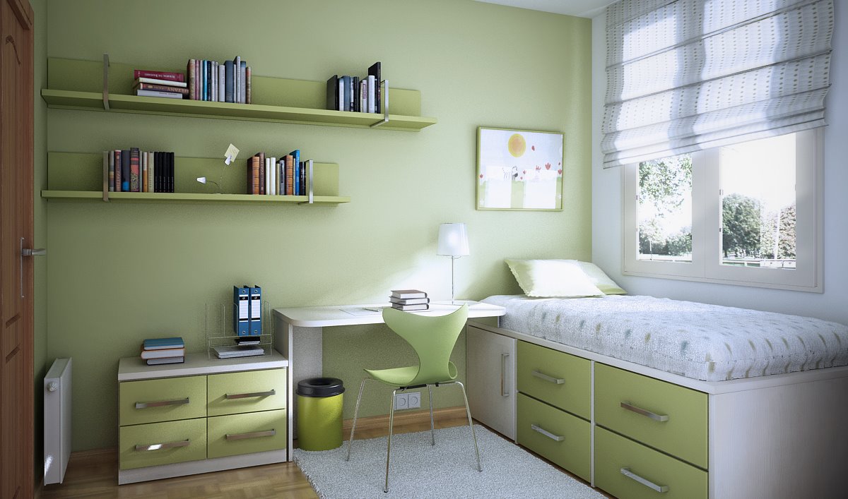 A pretty green teen room with a light green wall, some cabinets, a desk and a bed with drawers plus wall mounted shelves