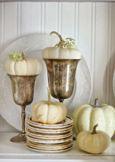 white pumpkins in plates and in goblets are adorable for simple and chic fall or Thanksgiving decor