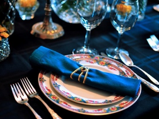 a teal tablecloth and napkins will give your Thanksgiving tablescape a non-traditional and fresh look