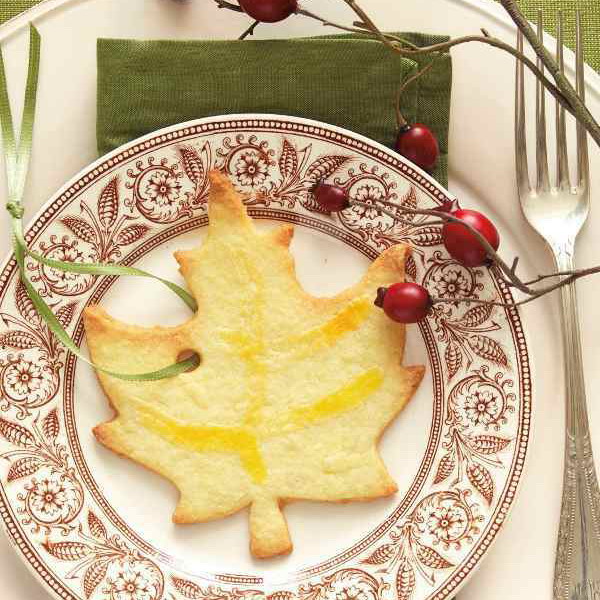 A pretty maple leaf shaped cookie with a ribbon is a great idea to mark each place setting and to give it as a party favor at the same time