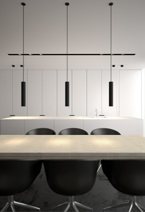 a minimalist dining space with a stained table, black chairs, black tube pendant lamp and white storage units