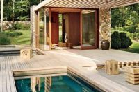tiny plunge pool with a wooden deck