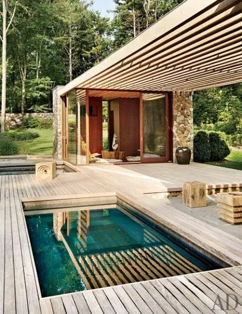 tiny plunge pool with a wooden deck