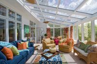traditional sunroom design with two conversation zones