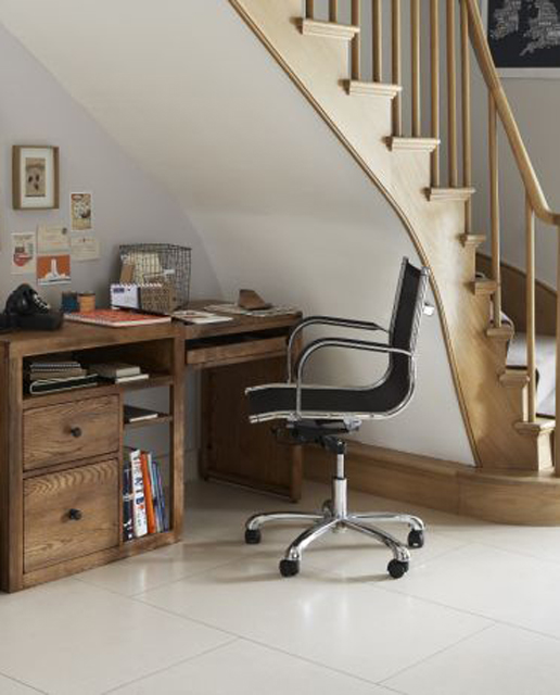 Organizing a home office under stairs is definitely a space saving idea.
