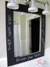 a mirror in a chalkboard frame is a creative idea for any bathroom, it’s a fun and interactive idea