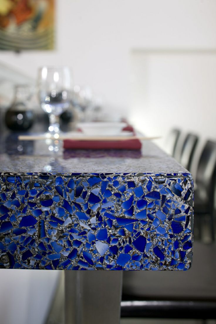 A bold blue mosaic coutertop with a touch of sparkle is a cool idea for a modern space