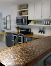 a penny countertop looks bold, cool and can be DIYed of coins and epoxy by you yourself
