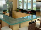 a blue glass countertop is a modern idea for a kitchen, though it’s not very durable, it’s stylish