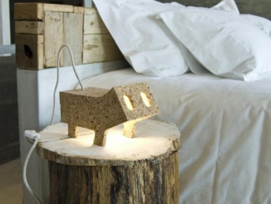 a plywood animal-shaped lamp that reminds of some pig is a fun and cheerful idea for a modern space