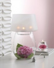 a romantic table lamp with a glass base – you can place anything inside, here there are blooms and greenery