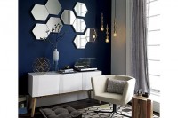 an arrangement of hexagon-shaped mirrors on the wall will make it more eye-catchy and cool and will bring a cool and edgy touch to the room