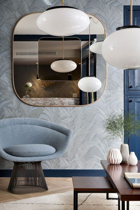 a stylish modern mirror with curved corners and an additional dark mirror in the center is a lovely idea for a modern space, it will add shape and color