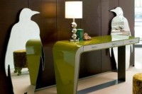unique penguin-shaped mirrors, a green console table with a lamp will make your modern or contemporary entryway chic, catchy and cool