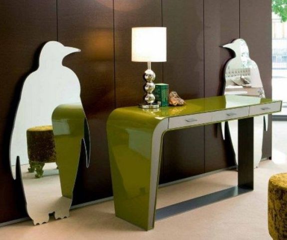 Unique penguin shaped mirrors, a green console table with a lamp will make your modern or contemporary entryway chic, catchy and cool