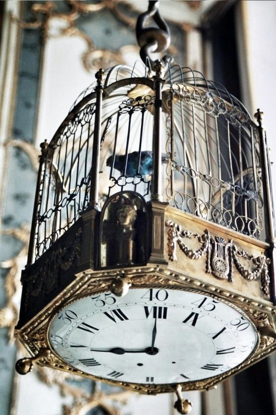 You could mount a clock mechanism on the bottom of a cage and hang it high. It'd be much cooler idea than a simple wall clock.