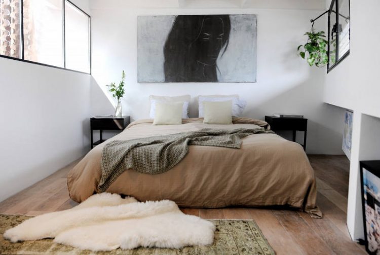 The bedroom is a bachelor one but not too masculine, decorated in earthy tones