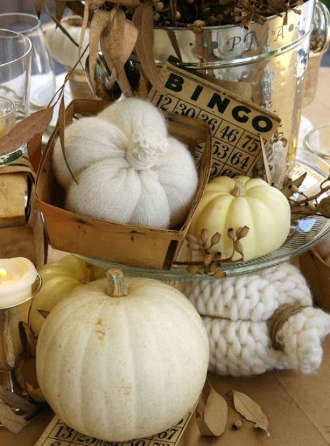 Vintage rustic Thanksgiving decor   knit and crochet pumpkins and neutral ones, candles and dried leaves look very decadent