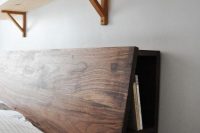 walnut masculine headboard with book storage