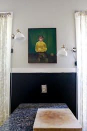 a little cooking or eating nook with white IKEA Ranarp wall sconces that illuminate the nook without taking table space