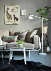 a white floor Ranarp lamp is a perfect fit for many spaces, here it’s integrated into a contemporary living room