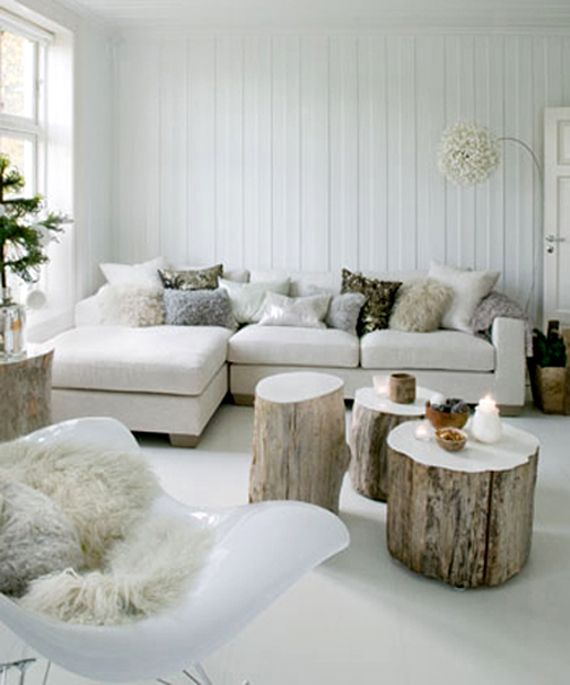 A variety of fluffy pillows make the living room very cozy and holiday like