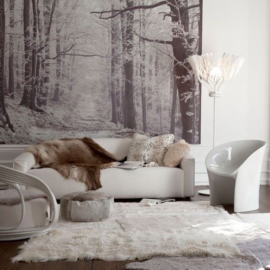 rugs, faux fur furniture and blankets plus pillows make the living room winter-ready and very welcoming