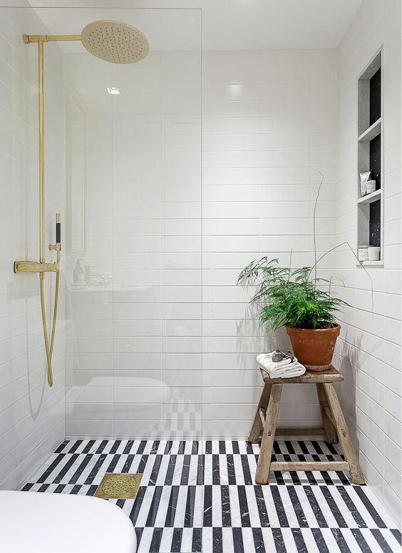 white bathroom design with a black and white floor