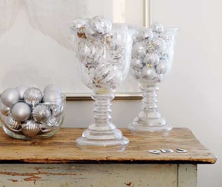A clear bowl and some large clear glasses filled with silver ornaments are amazing for winter holiday decor, these are easy centerpieces
