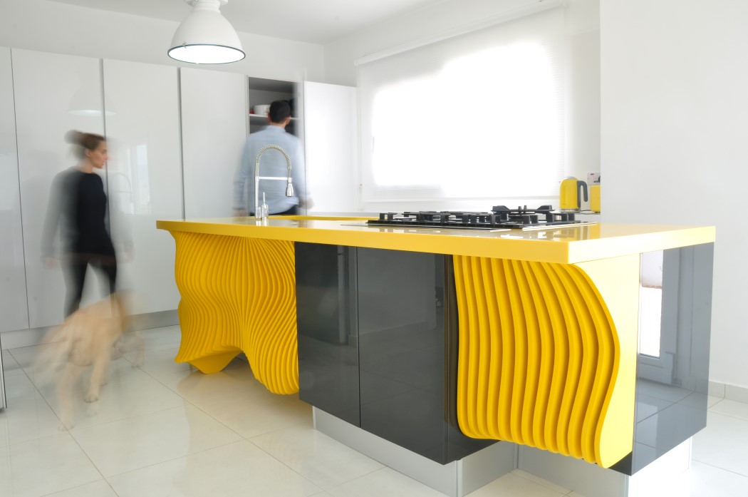 White minimalist kitchen with a sculptural yellow island  1