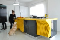white-minimalist-kitchen-with-a-sculptural-yellow-island-2
