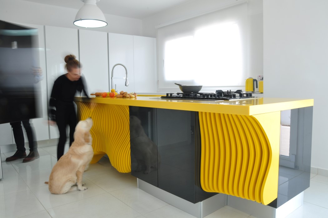 White minimalist kitchen with a sculptural yellow island  2