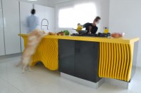 white-minimalist-kitchen-with-a-sculptural-yellow-island-5