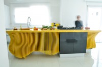 white-minimalist-kitchen-with-a-sculptural-yellow-island-7