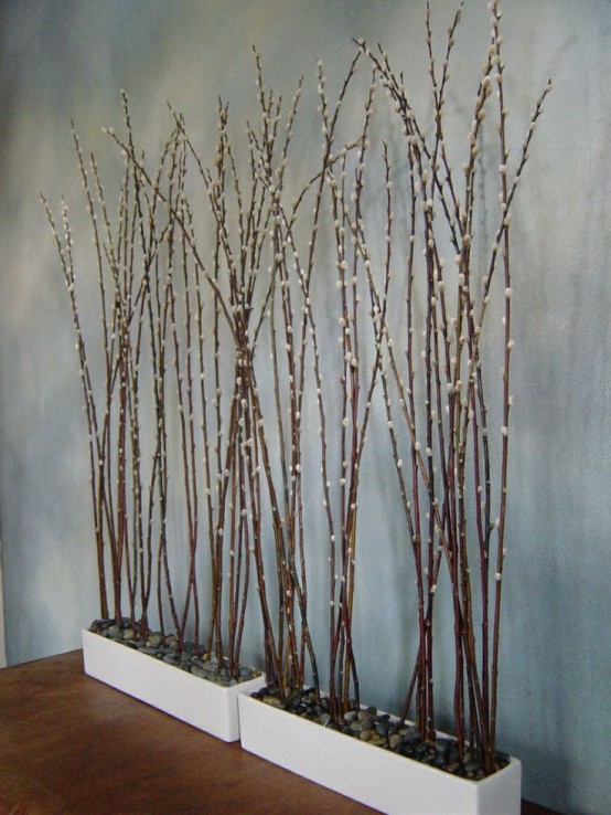 white planters with pebbles and tall willow are a cool decoration for spring - indoor or outdoor